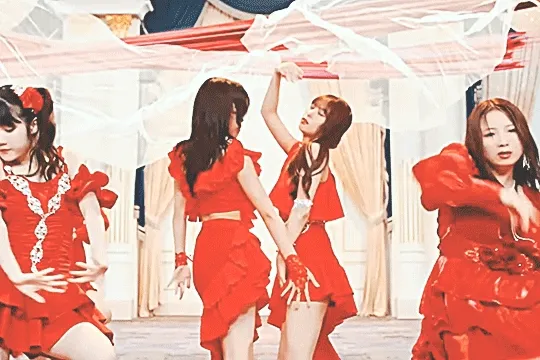 juice=juice members, specifically riai and sakura, dancing in the amore mi amore music video