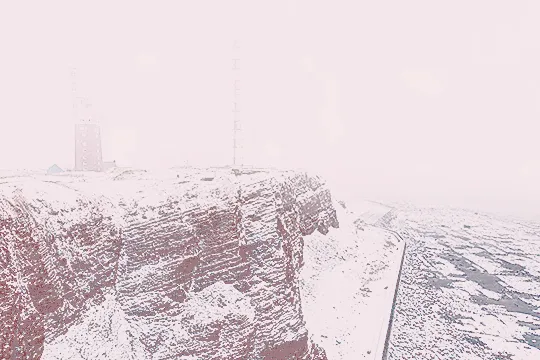 original photo by Thomas Haeusler of a snow-covered winter mountain landscape, with lots of fog and buildings in the distance. the photo is sharpened and tinted pink