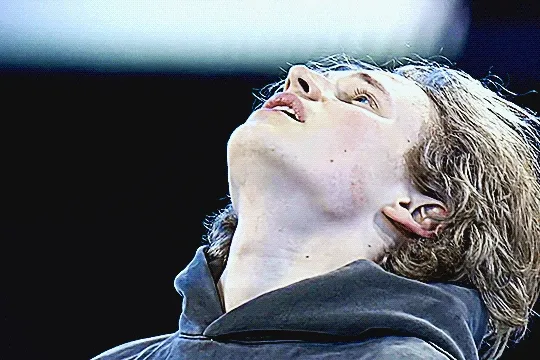 ilia after the gala skate, breathing heavily with his head tilted upward, swallowing and seeming emotional